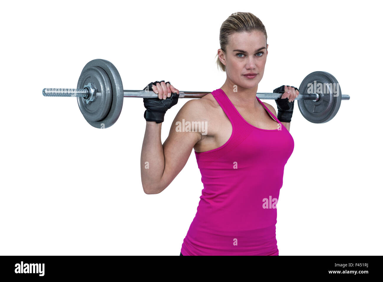 Sporty female bodybuilder lifting barebell Stock Photo