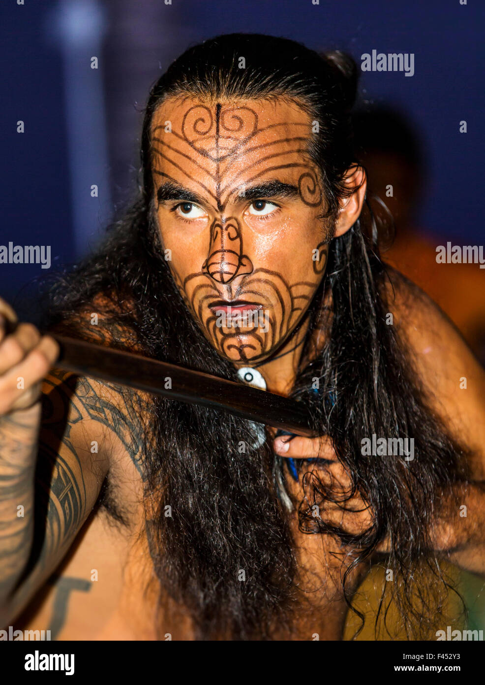 Native male Hawaiian performing traditional dance at Lua, Big Island, Hawai'i, USA Stock Photo