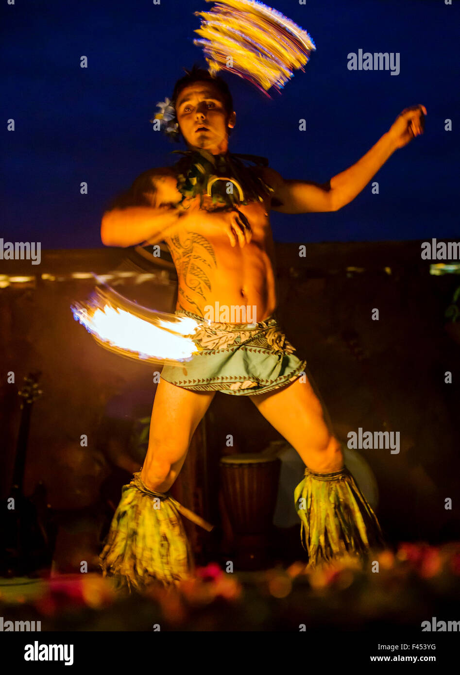 Native male Hawaiian performing traditional fire dance at Lua, Big Island, Hawai'i, USA Stock Photo