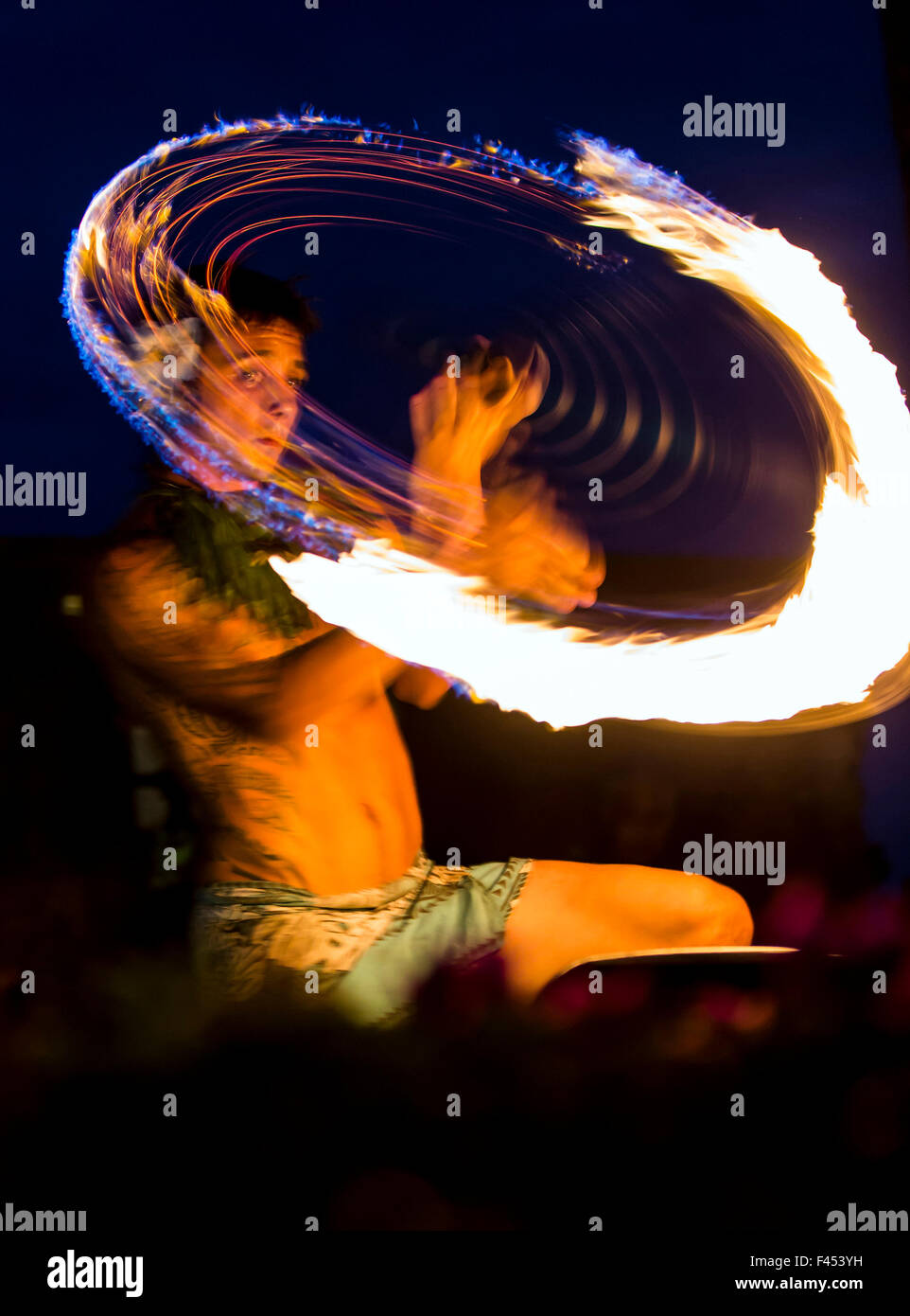 Native male Hawaiian performing traditional fire dance at Lua, Big Island, Hawai'i, USA Stock Photo