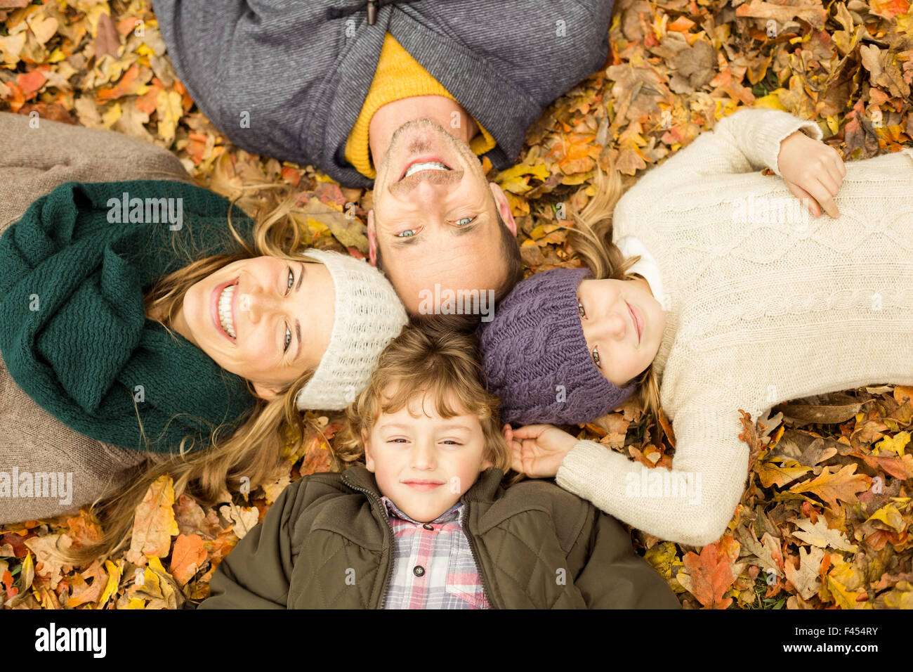 Smiling young family doing a head circles Stock Photo