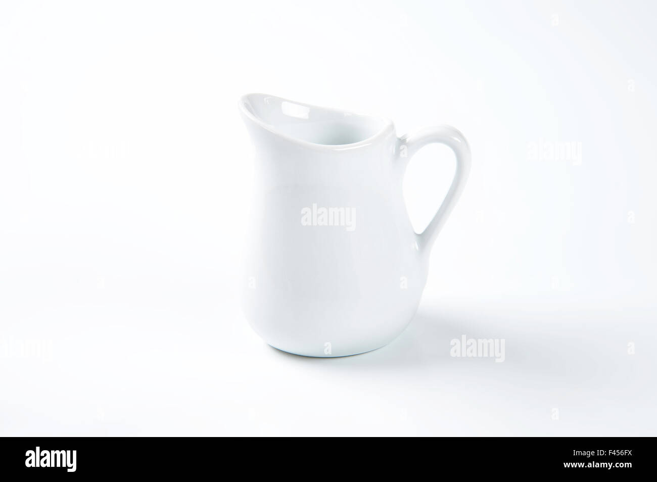 https://c8.alamy.com/comp/F456FX/white-milk-jug-on-white-background-F456FX.jpg