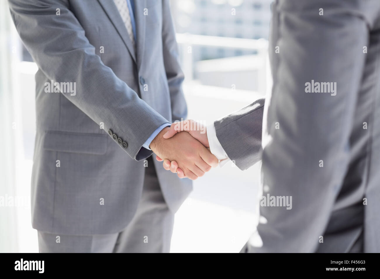 Business Colleagues Greeting Each Other Stock Photo Alamy