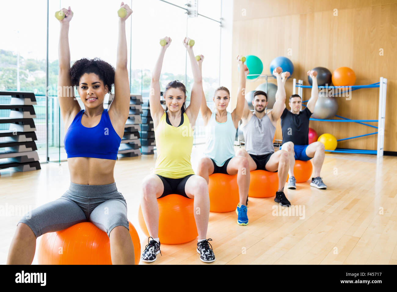Fitness class exercising in the studio Stock Photo