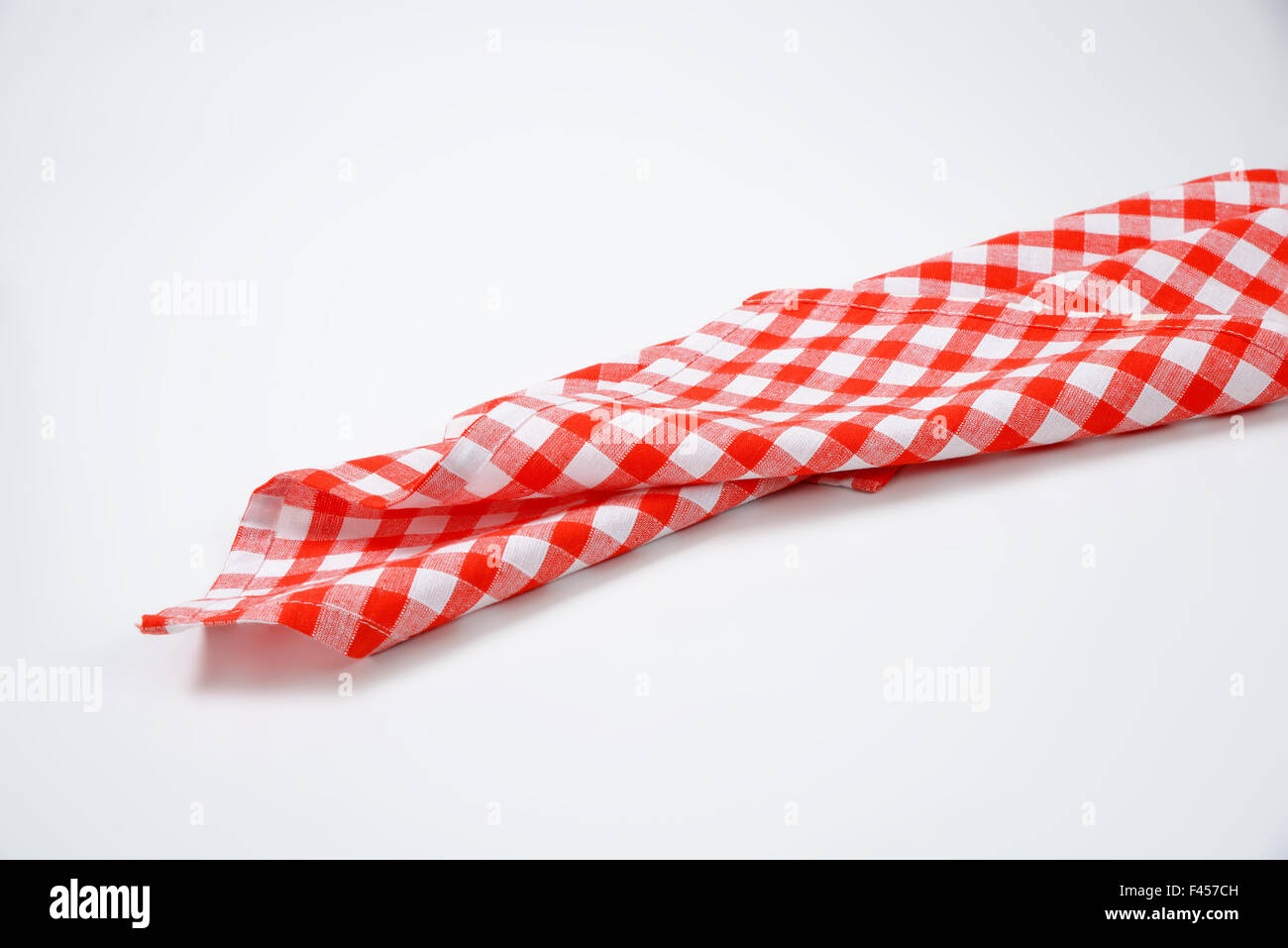 red and white checkered napkin on white background Stock Photo