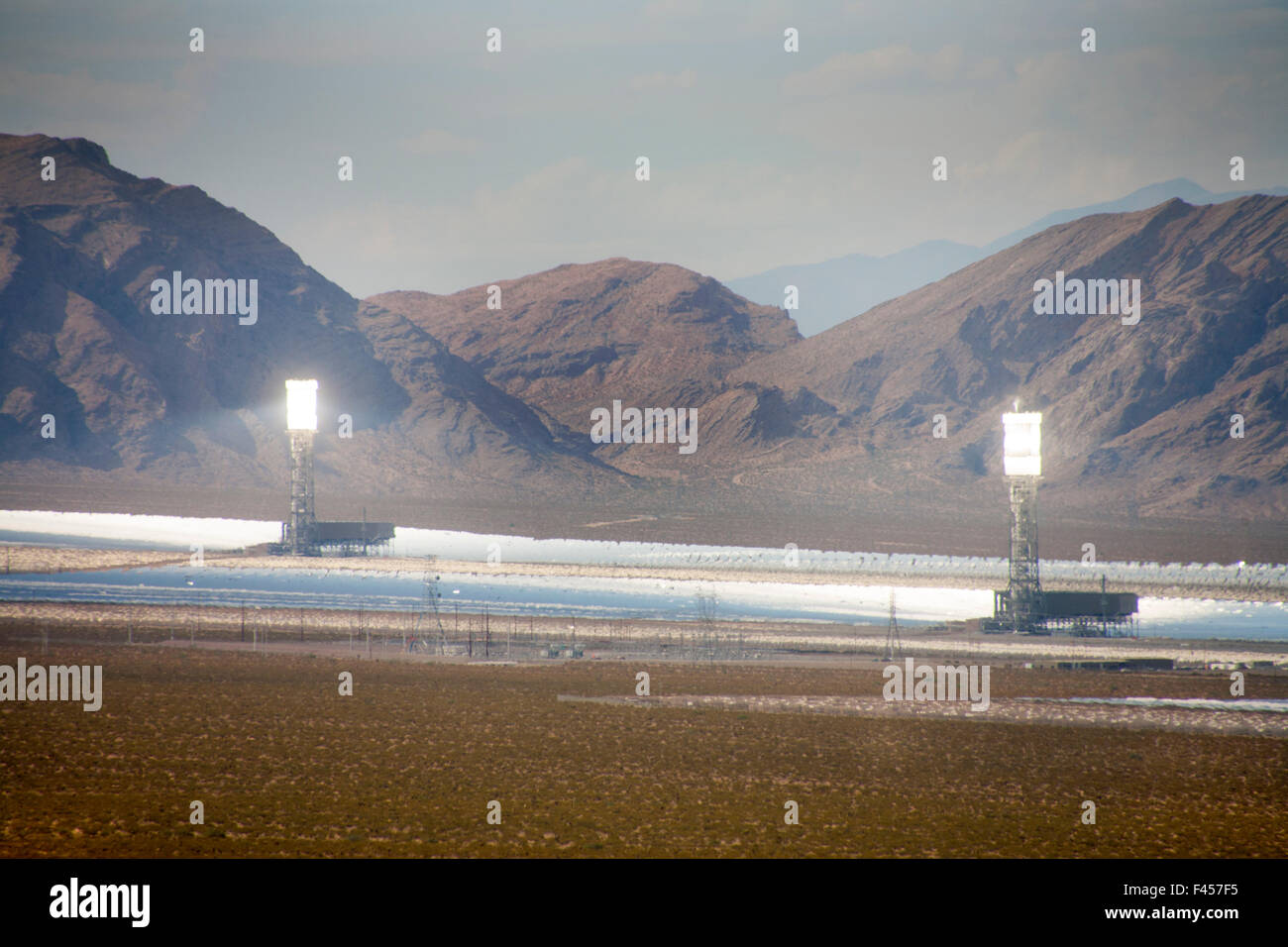 The Ivanpah Solar Electric Generating System is a concentrated solar thermal plant in the California Mojave Desert with a gross capacity of 392 megawatts. It deploys 173,500 heliostats focusing solar energy on boilers in centralized solar power towers. Stock Photo