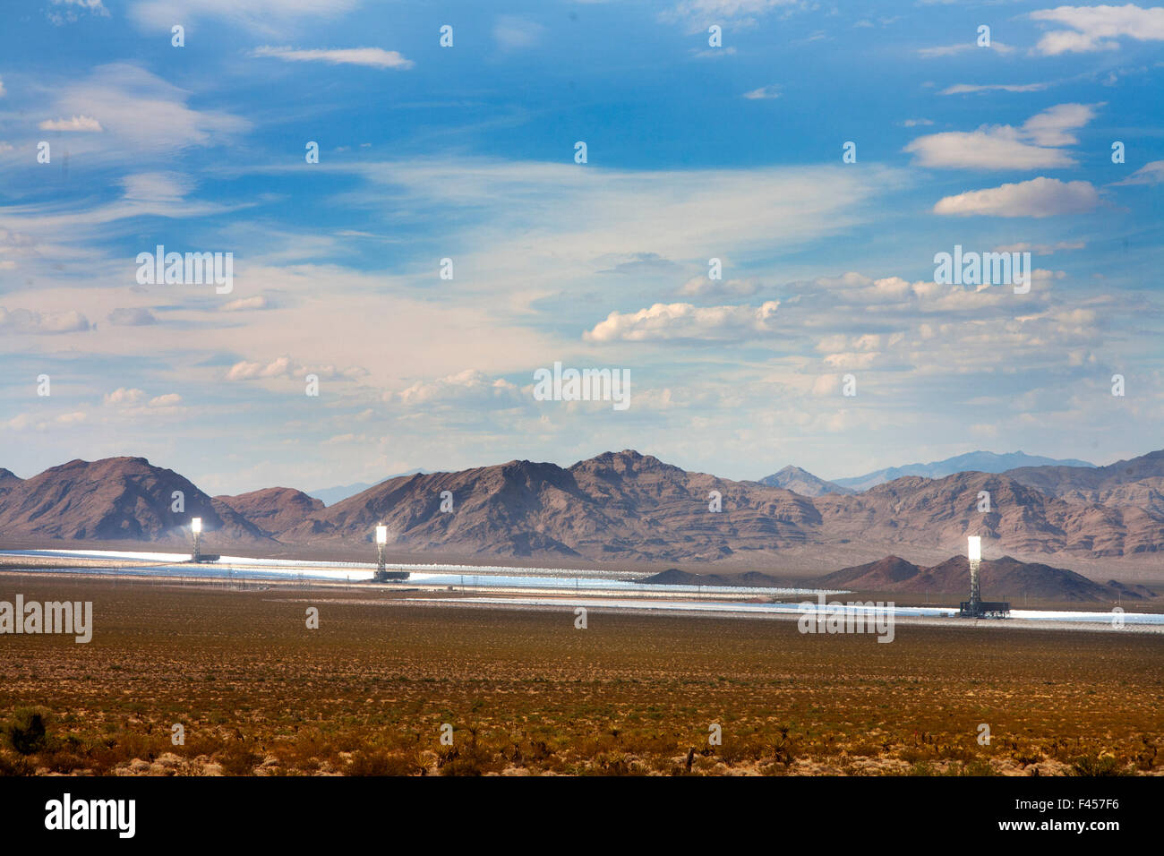 The Ivanpah Solar Electric Generating System is a concentrated solar thermal plant in the California Mojave Desert with a gross capacity of 392 megawatts. It deploys 173,500 heliostats focusing solar energy on boilers in centralized solar power towers. Stock Photo