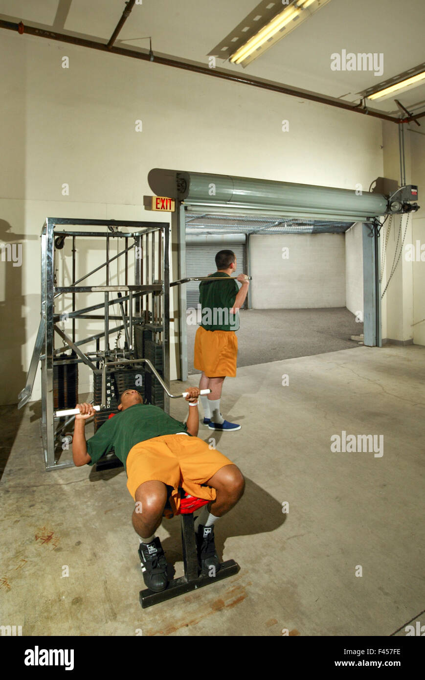 Hispanic teenage inmates stay in shape in the gym of an Orange, CA, juvenile prison. Note uniform gym clothing. Stock Photo