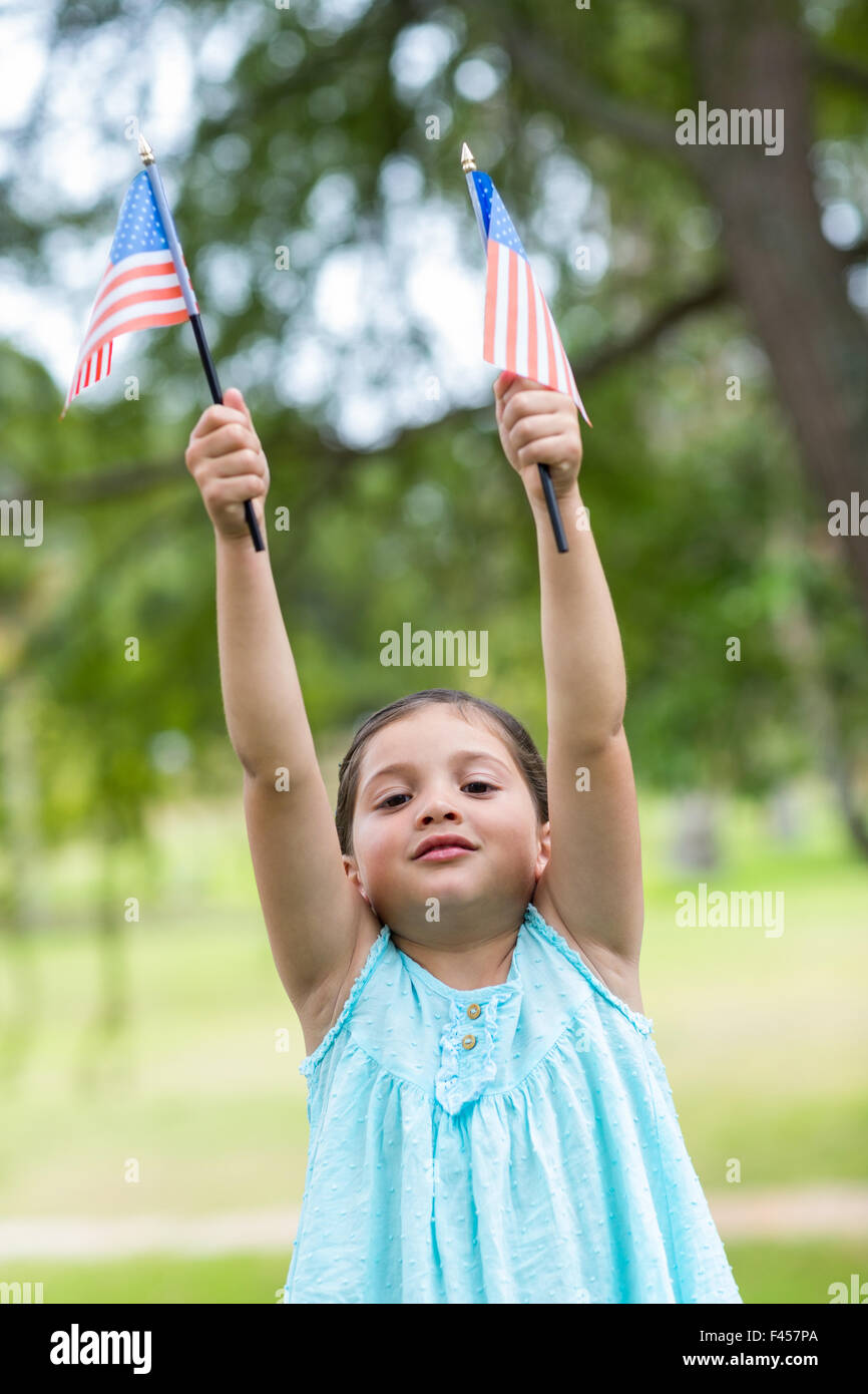 Little girl waving american flag Stock Photo Alamy
