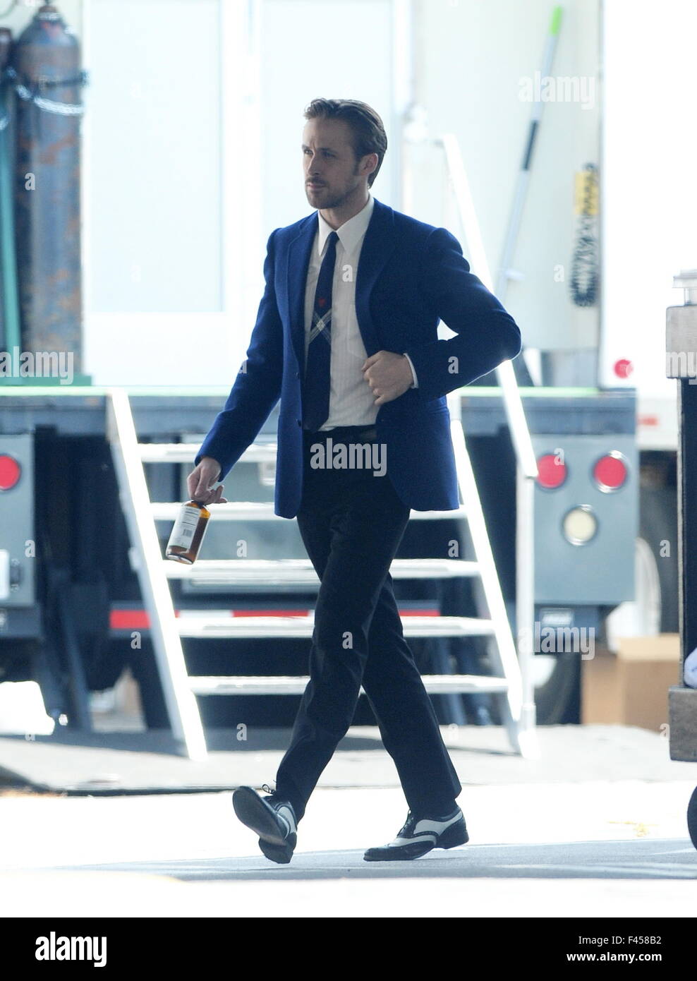 Actress Emma Stone glowing in her blue dress on the set of "La La Land"  with co star Ryan Gosling who sported a vintage blue blazer for the scene  filming in Los Angeles. Featuring: Emma Stone Where: Los Angeles,  California, United States When: 14 Aug ...