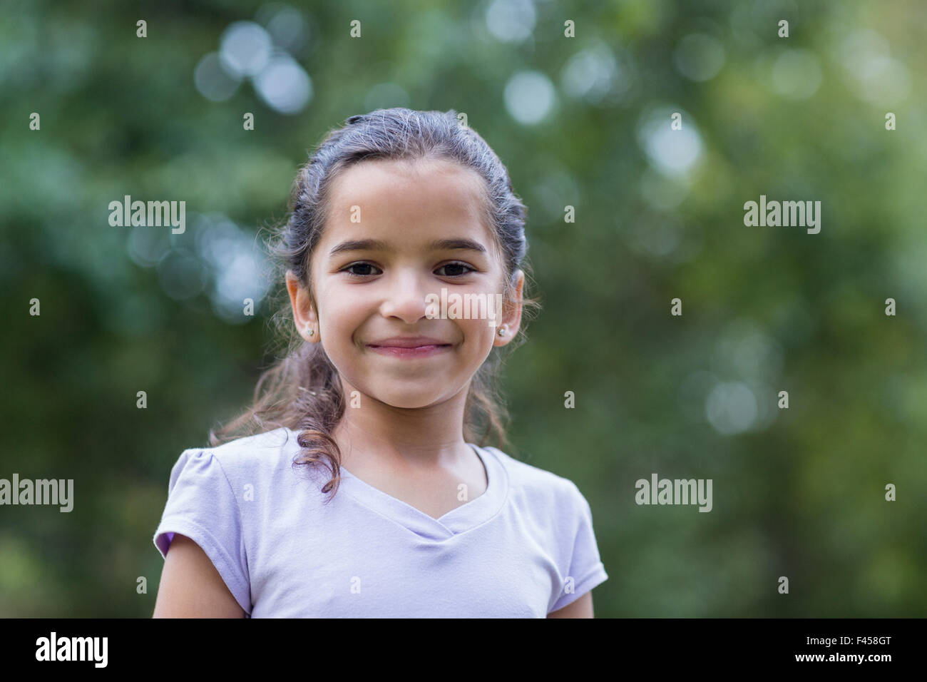 Little girl smiling at the camera Stock Photo - Alamy