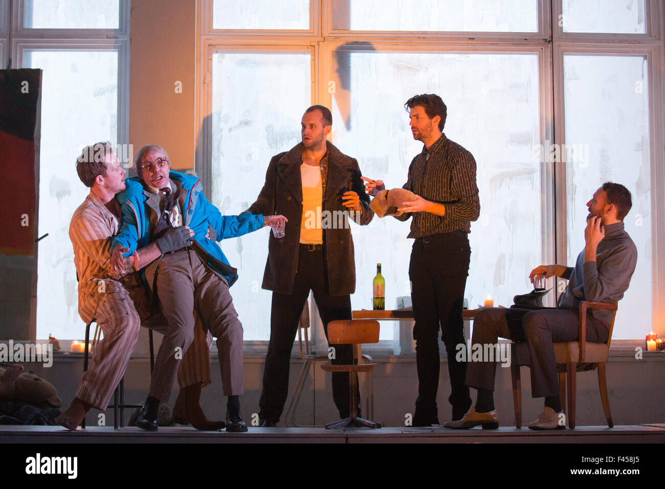 London, UK. 14/10/2015. L-R: Duncan Rock as Marcello, Simon Butteriss as Benoit, Nicholas Masters as Colline, Zach Borichevsky as Rodolfo and Ashley Riches as Schaunard. Dress rehearsal of the Giacomo Puccini opera La Boheme directed by Benedict Andrews at the London Coliseum. Conducted by Xian Zhang. Cast: Corinne Winters as Mimi, Zach Borichevsky as Rodolfo, Duncan Rock as Marcello and Rhian Lois as Musetta. Stock Photo