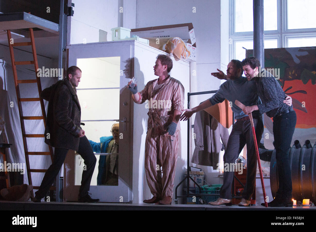 London, UK. 14/10/2015. L-R: Nicholas Masters as Colline, Simon Butteriss as Benoit, Duncan Rock as Marcello, Ashley Riches as Schaunard and Zach Borichevsky as Rodolfo. Dress rehearsal of the Giacomo Puccini opera La Boheme directed by Benedict Andrews at the London Coliseum. Conducted by Xian Zhang. Cast: Corinne Winters as Mimi, Zach Borichevsky as Rodolfo, Duncan Rock as Marcello and Rhian Lois as Musetta. Stock Photo