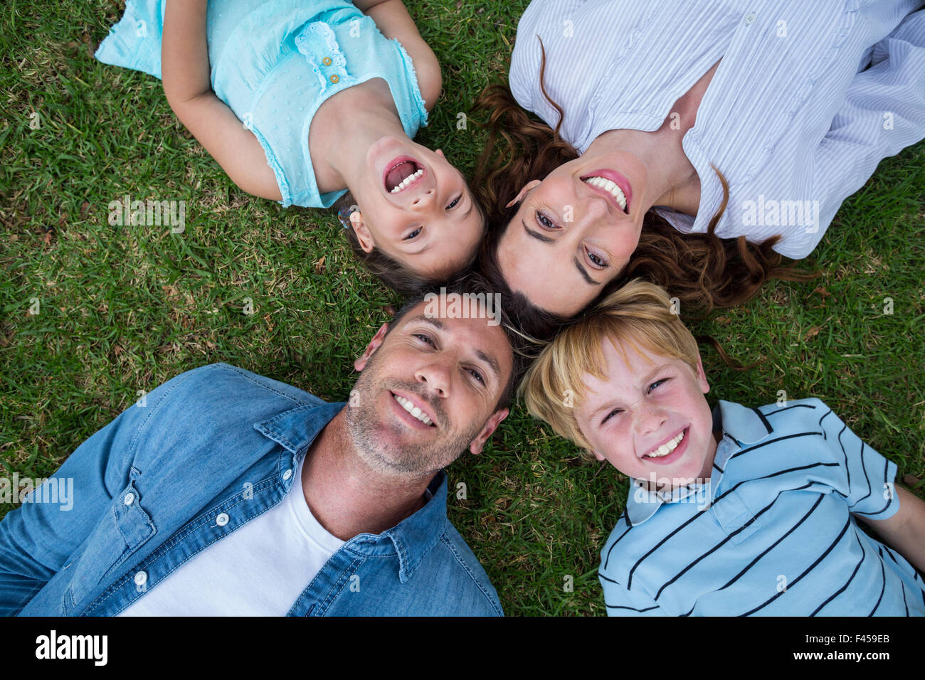 Happy family in the park together Stock Photo - Alamy