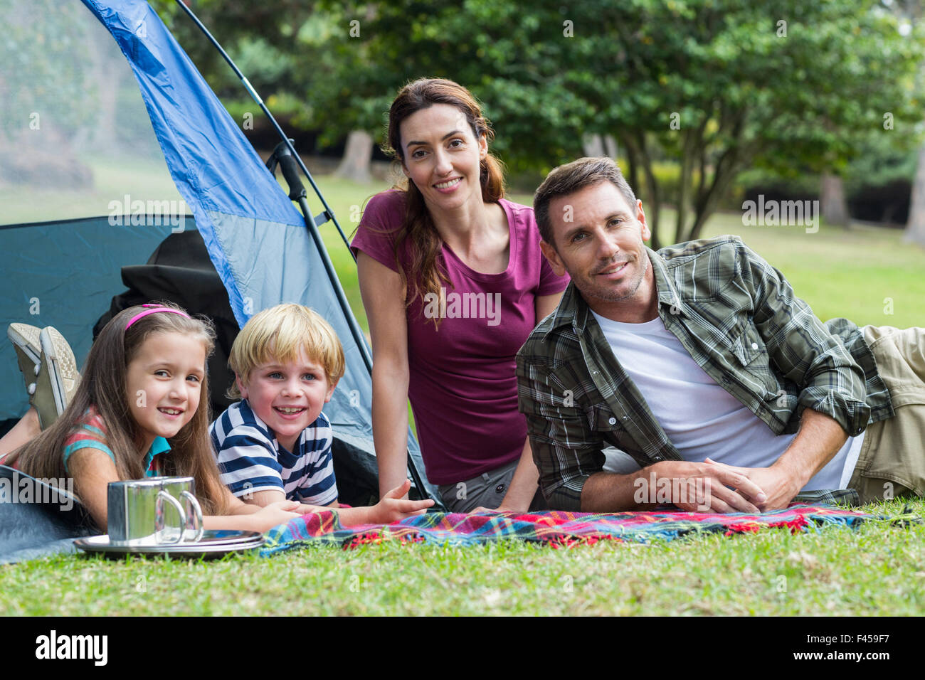 Happy family in the park together Stock Photo - Alamy
