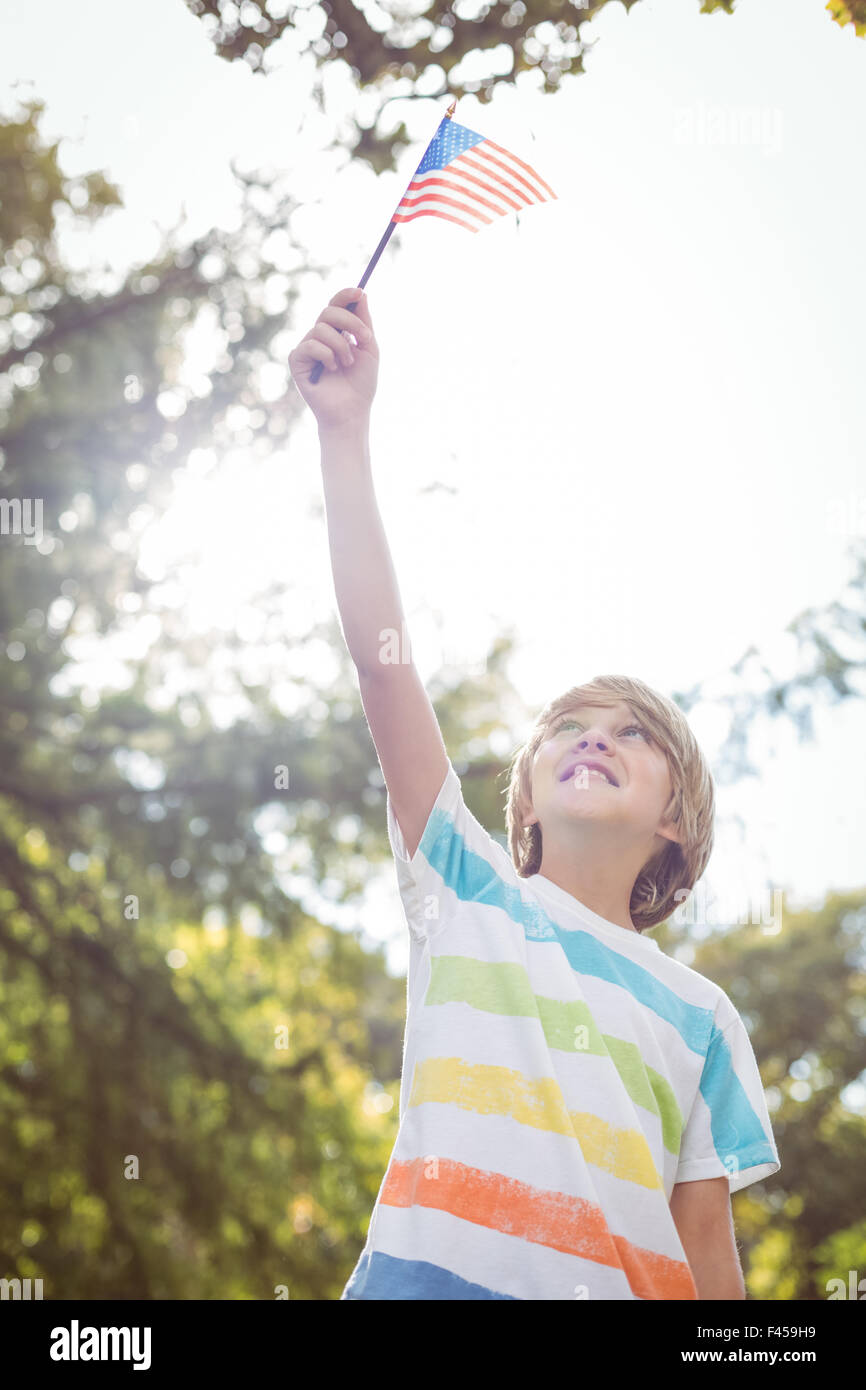 Young boy holding an american flag Stock Photo - Alamy