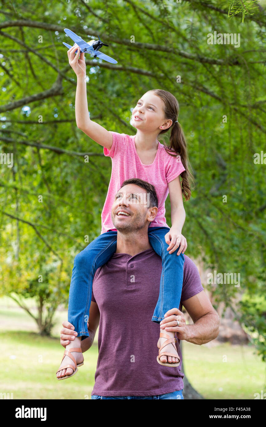 Father and daughter having fun in the park Stock Photo - Alamy