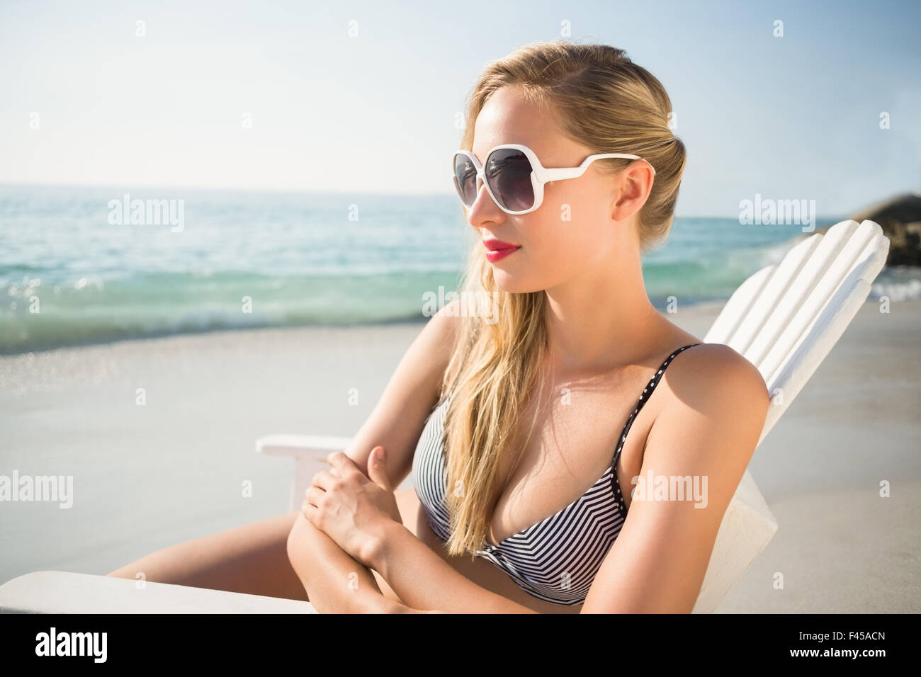 Adorable slim girl in a swimsuit with a perfect figure on the beach  18044085 Stock Photo at Vecteezy