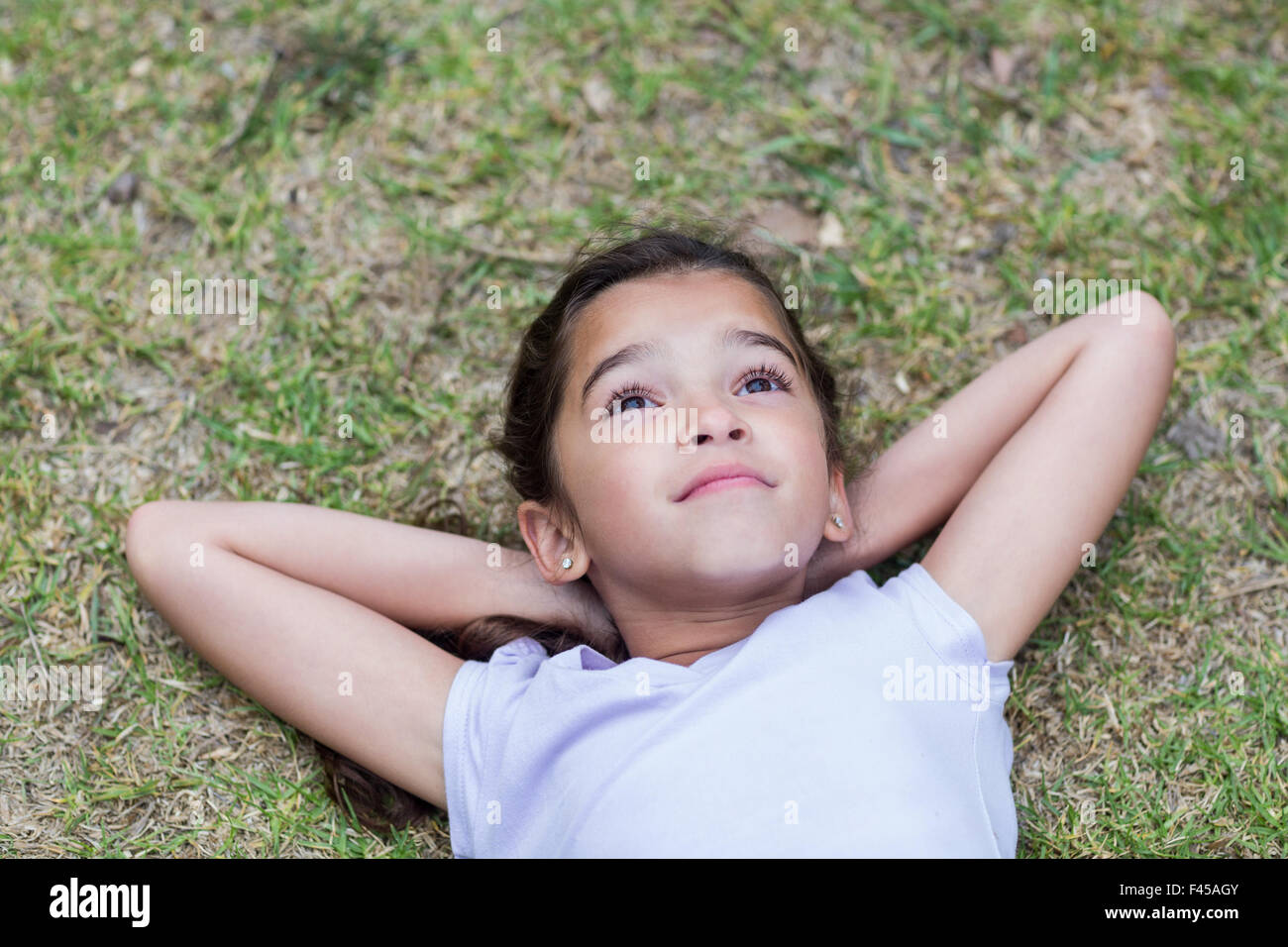 Little girl smiling at the camera Stock Photo - Alamy