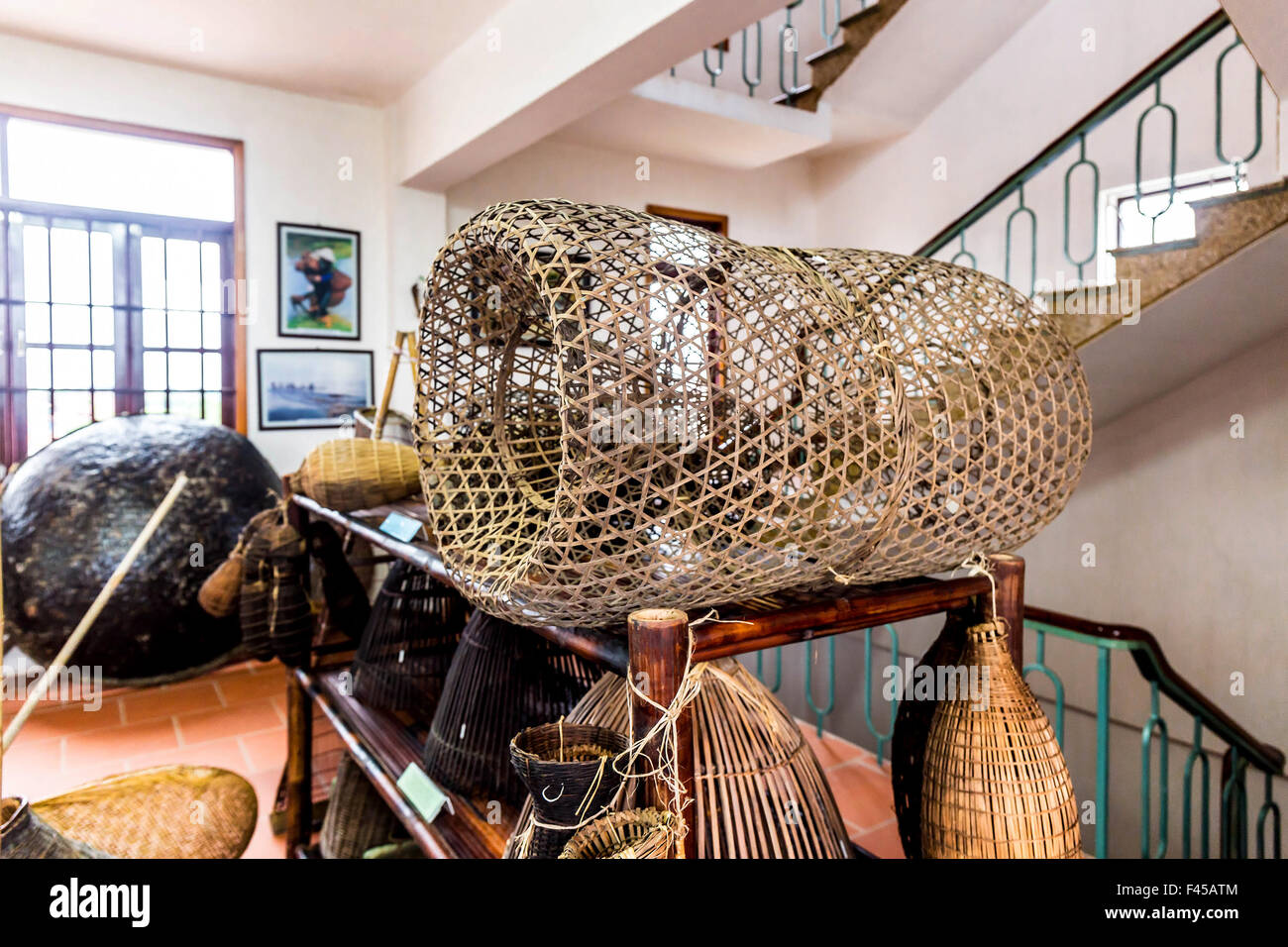 Ancient Vietnamese farming and fishing tools on display Stock Photo - Alamy