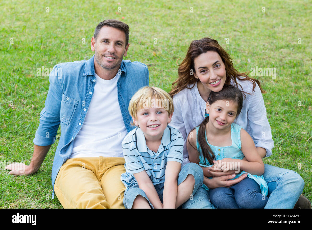 Happy family in the park together Stock Photo - Alamy