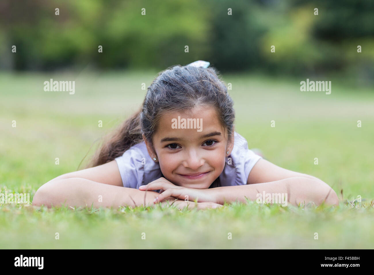 Little girl smiling at the camera Stock Photo - Alamy