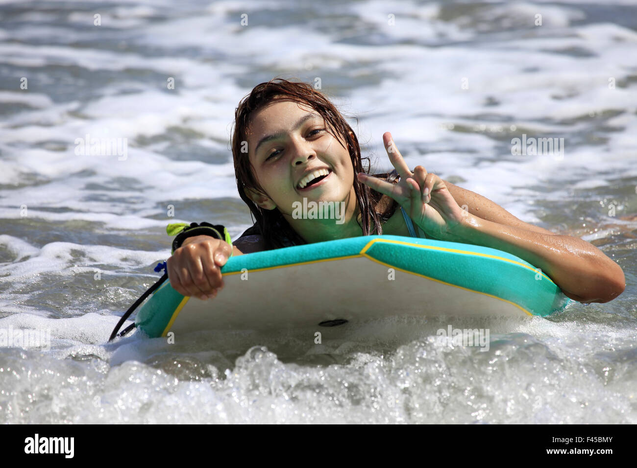 Surfer girl with surfboard hi-res stock photography and images - Alamy