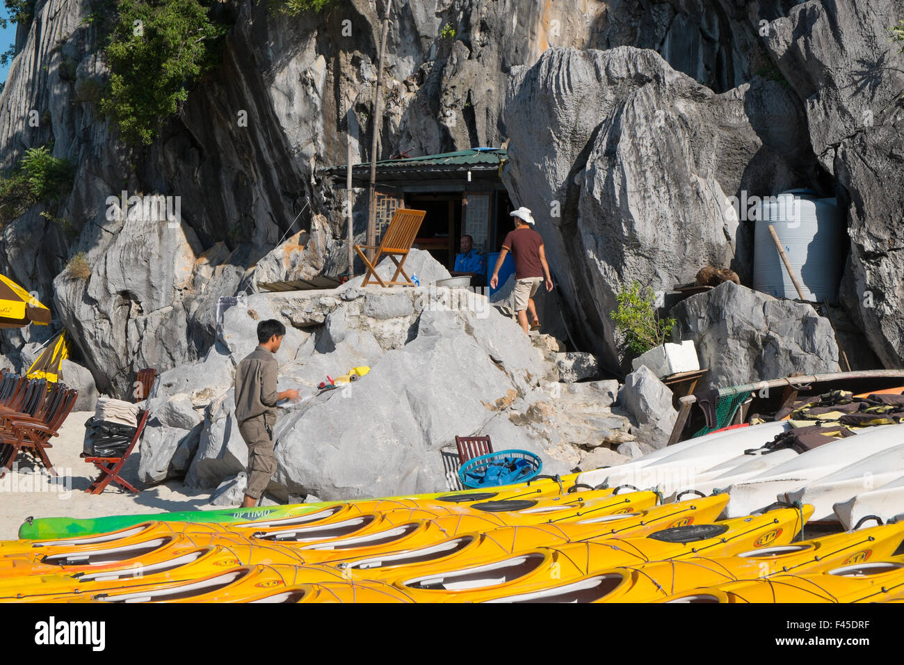 kayaks on the beach at Cang Do island in Bai Tu long day Halong Bay, north east Vietnam,Asia. A world heritage location. Stock Photo