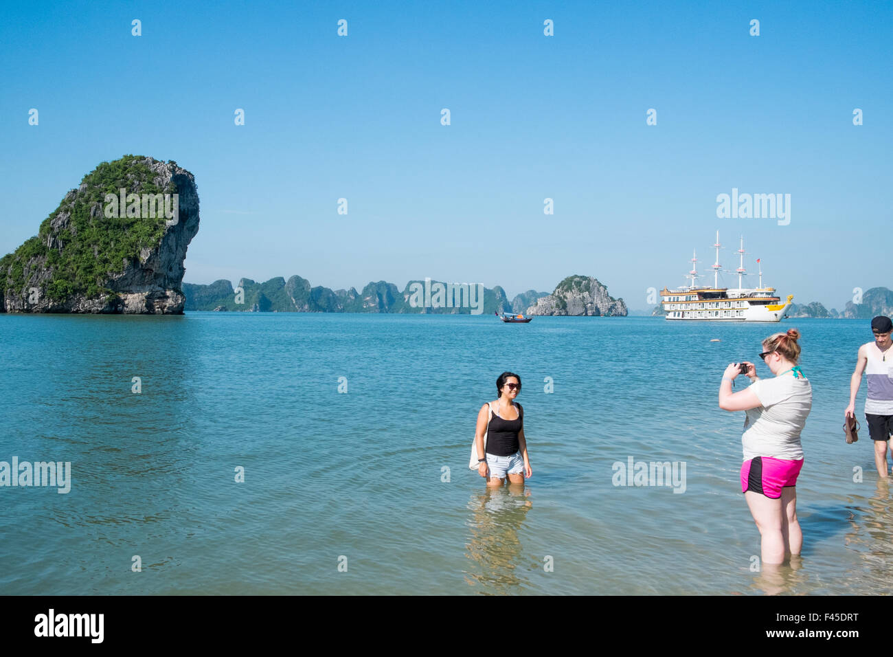 tourists on the beach at Cang Do Island,Bai Tu long bay in Halong Bay,Vietnam Stock Photo