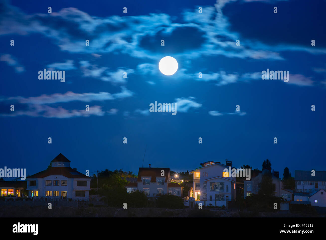 Moon Over The Town Stock Photo Alamy