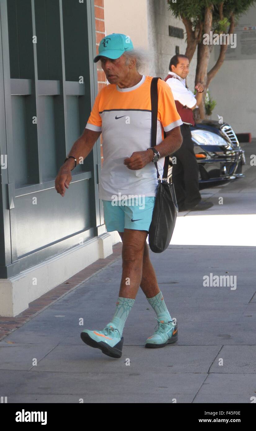 Billionaire 'NBA superfan', James Goldstein wearing orange and pastel