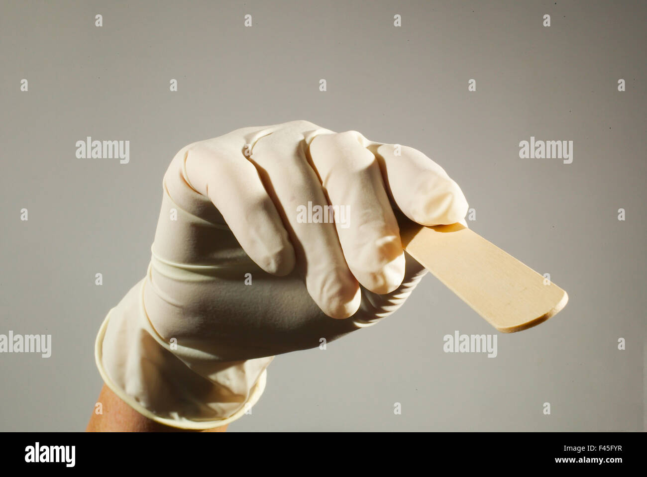 A tongue depressor is a wooden tool used in medical practice to depress