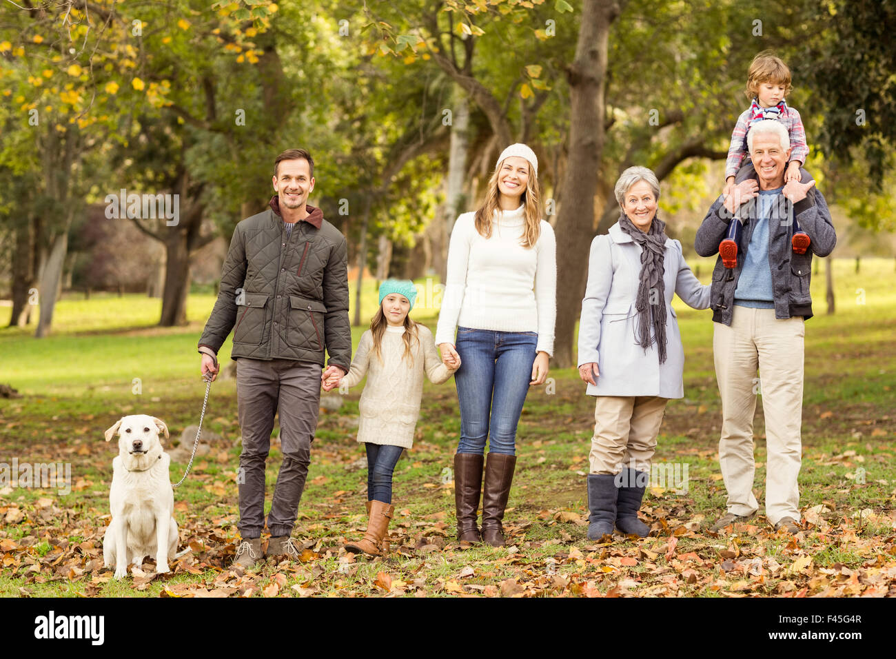 Extended family posing with warm clothes Stock Photo
