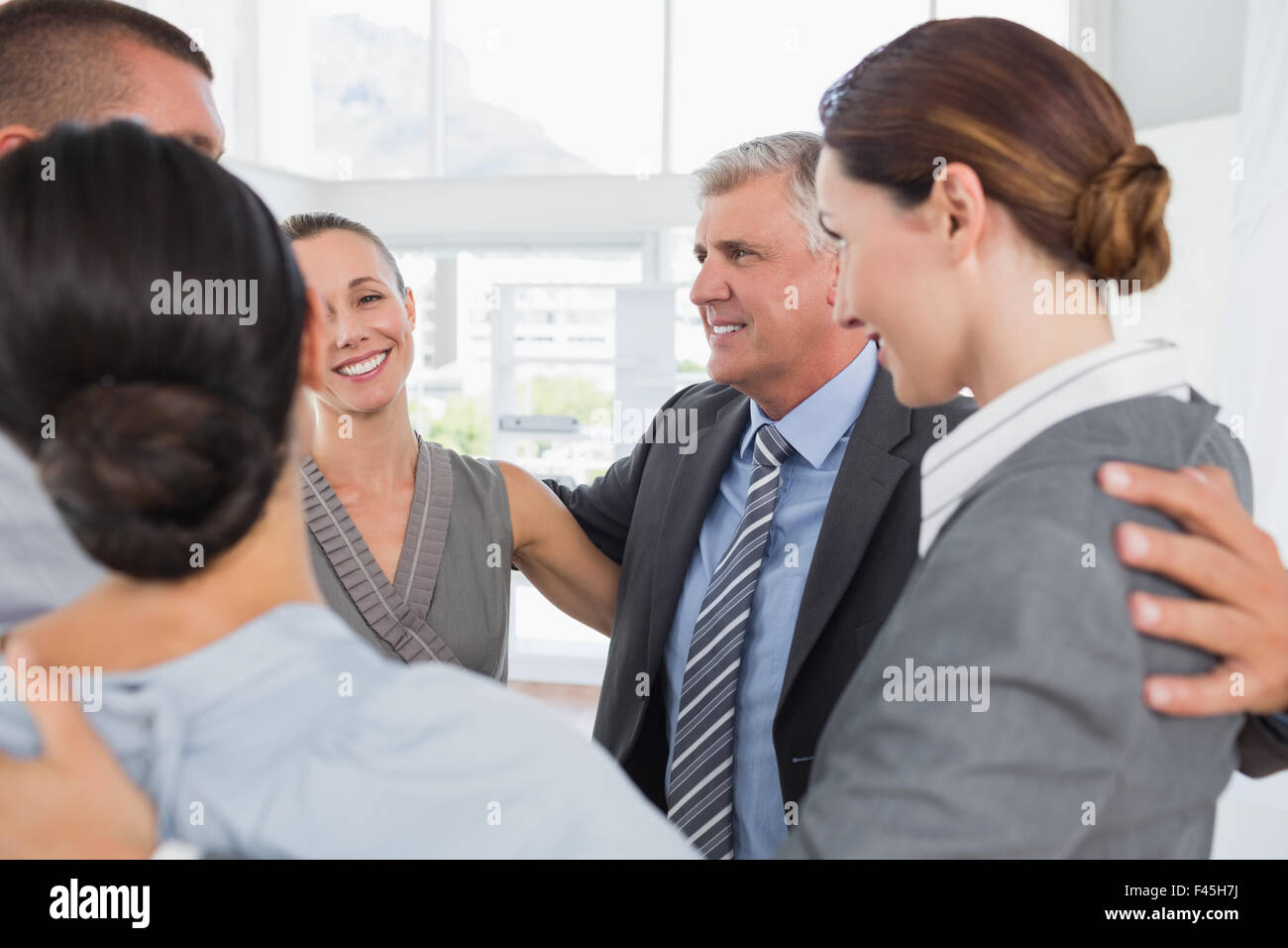 Business team standing in circle Stock Photo - Alamy