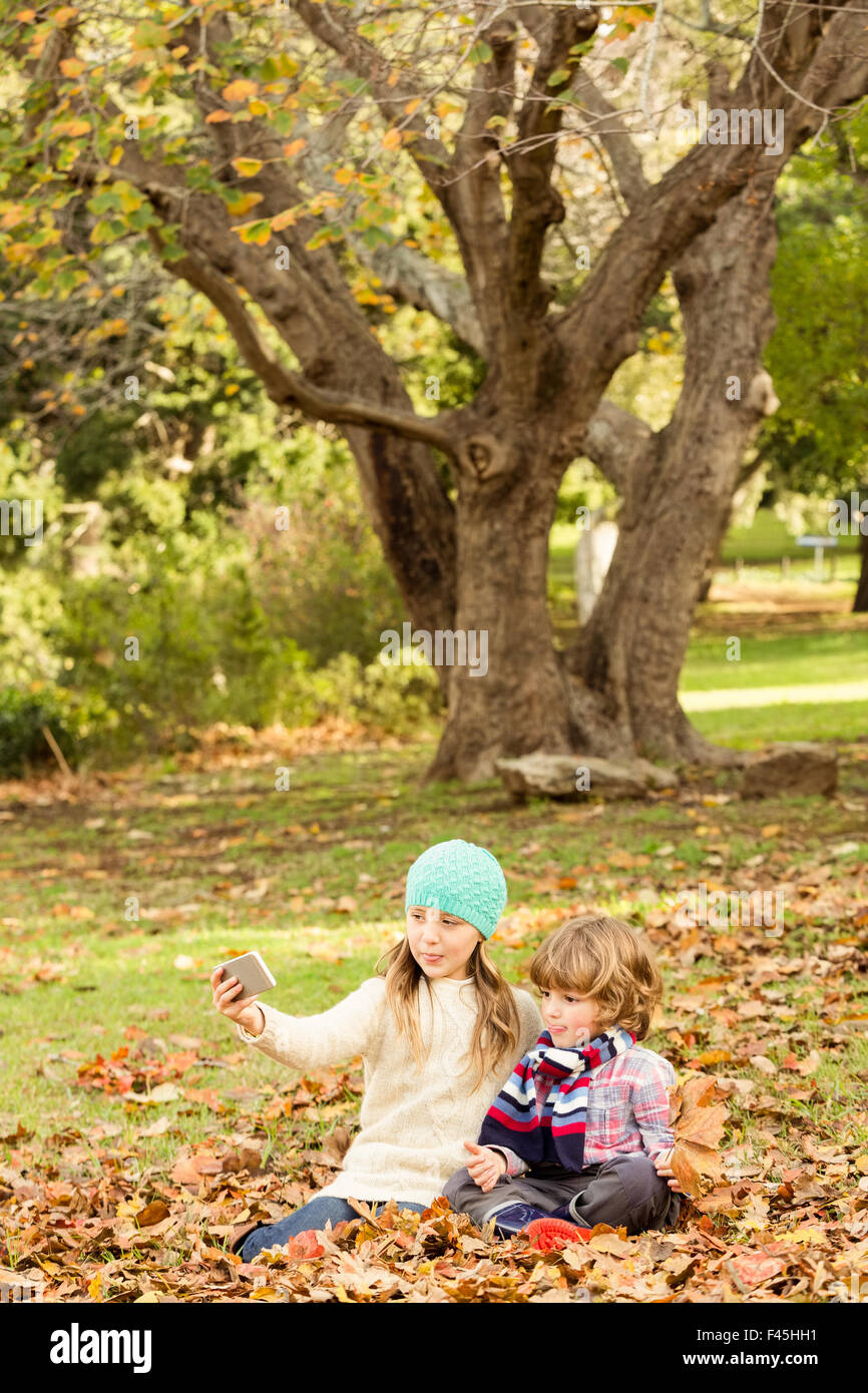 Happy siblings in the park Stock Photo