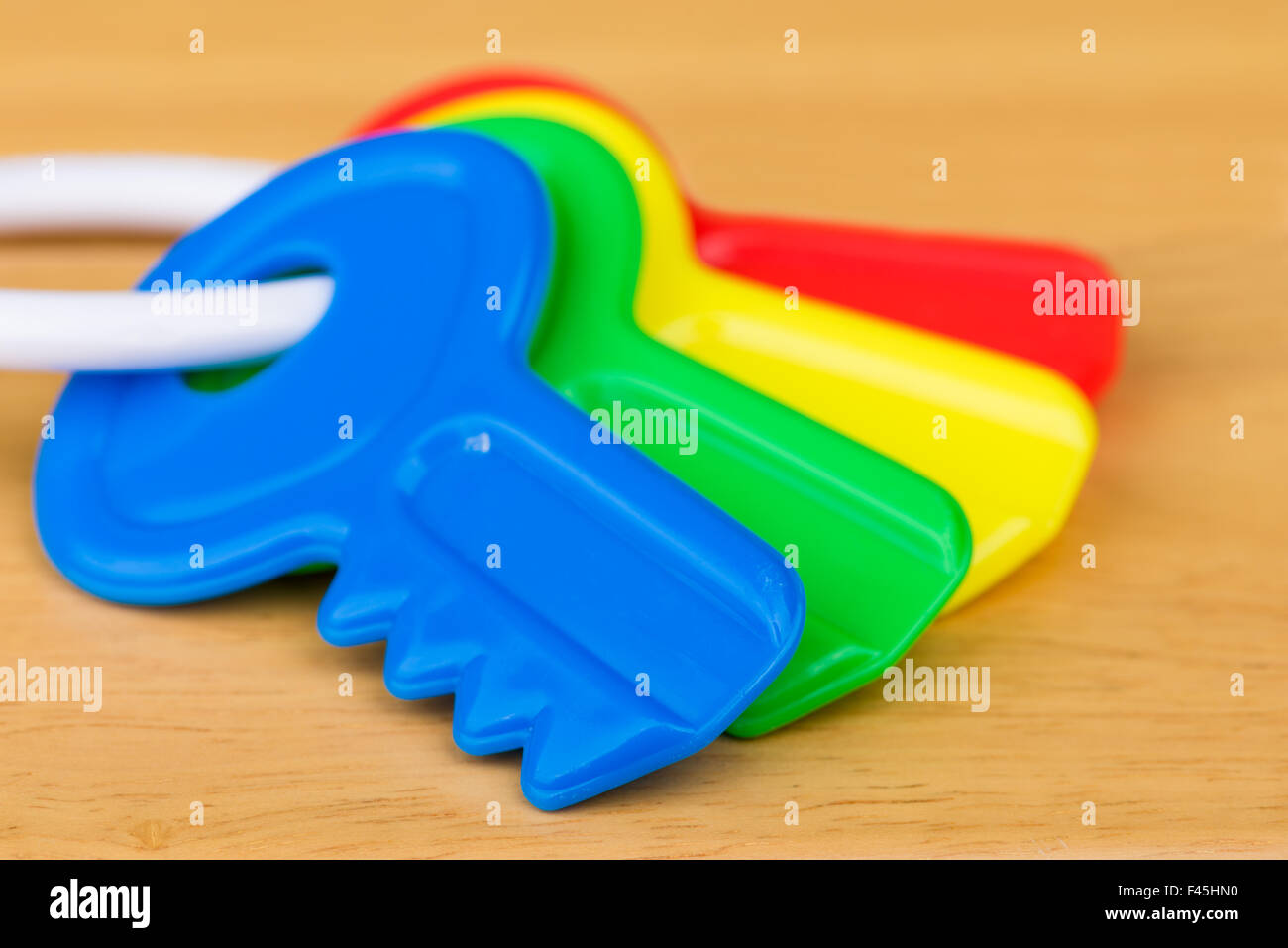 A close up shot of four colorful kid's toy keys. Stock Photo