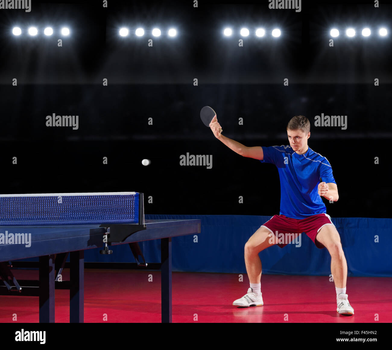 Young table tennis player at sports hall Stock Photo - Alamy