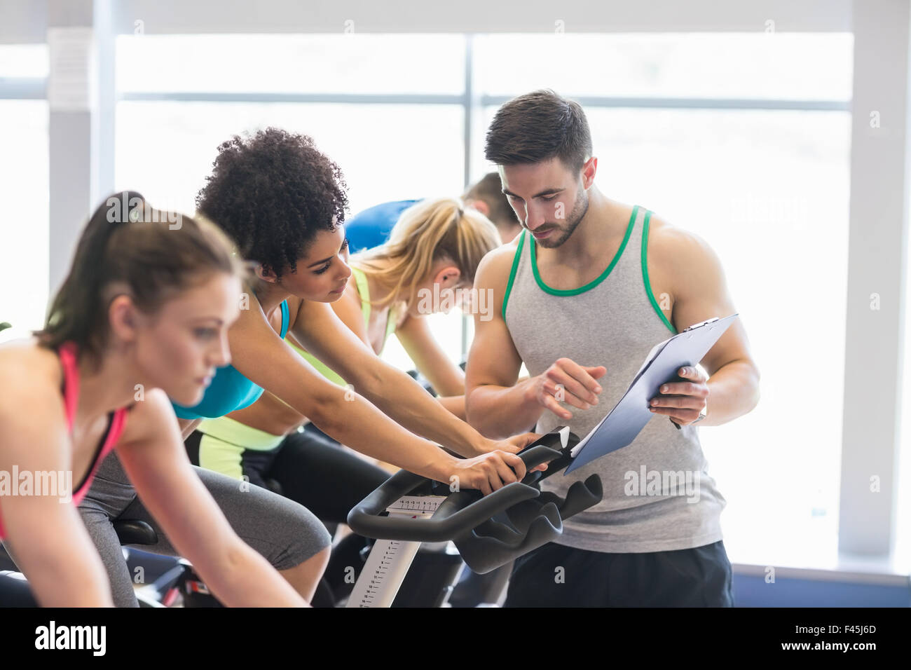 Fit people in a spin class Stock Photo