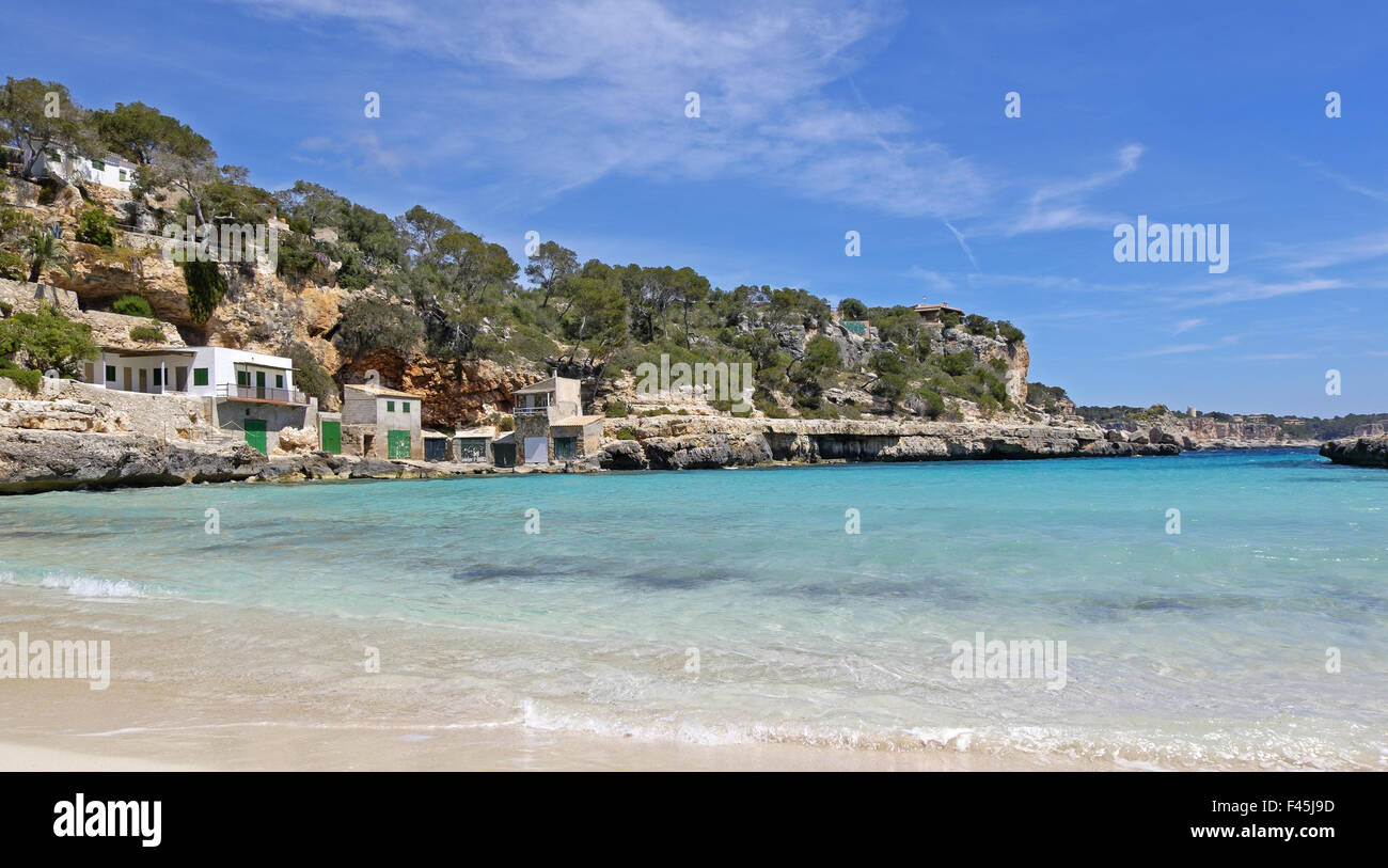 Boat houses in Cala Llombards Stock Photo