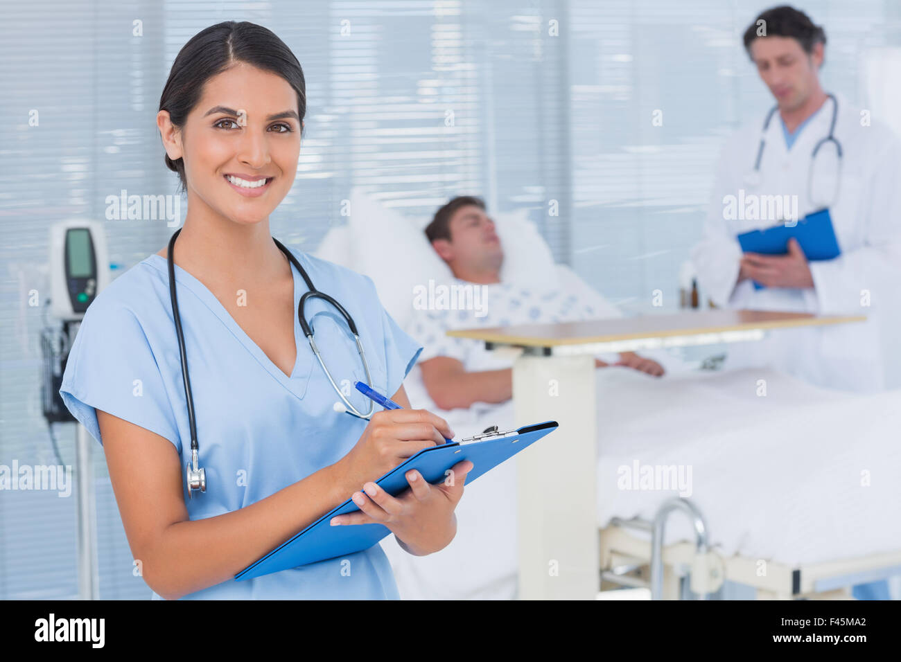 Doctors taking care of patient Stock Photo Alamy