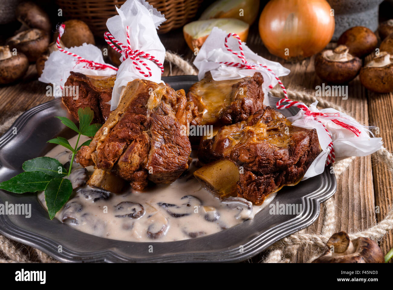 Grilled rinderrippchen with mushroom sauce Stock Photo - Alamy