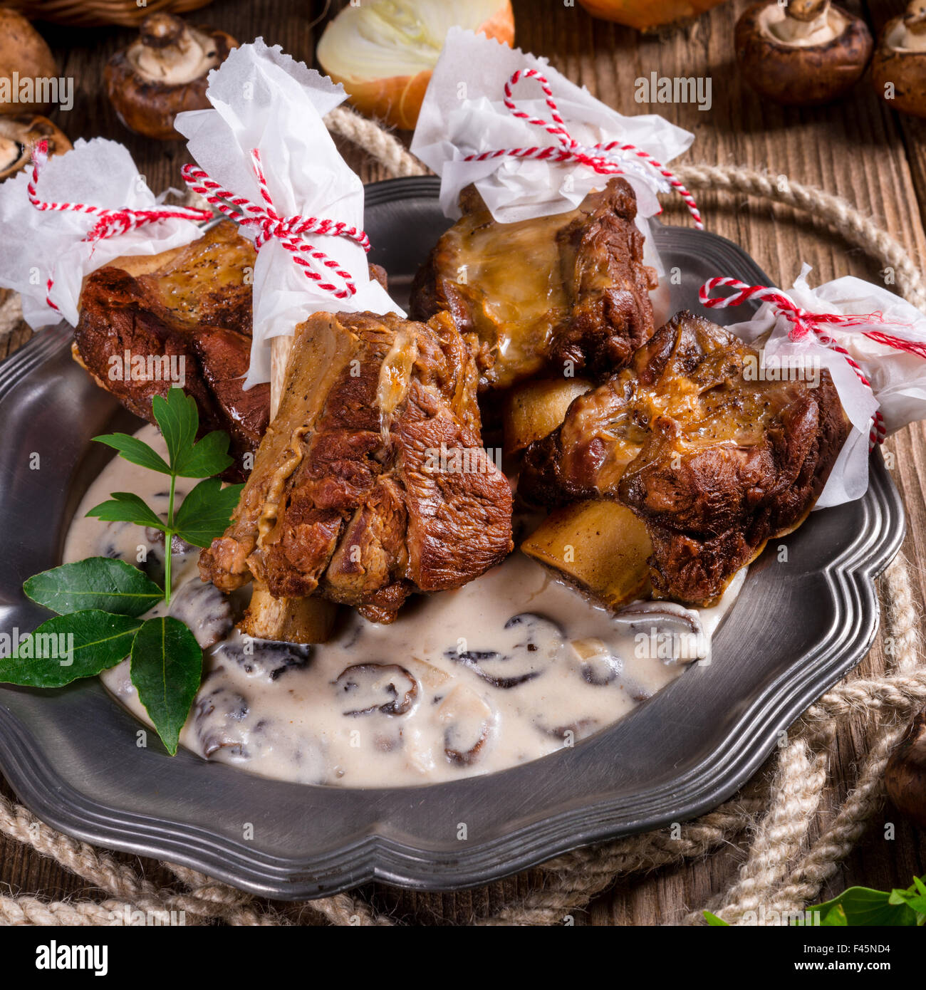 Grilled rinderrippchen with mushroom sauce Stock Photo - Alamy