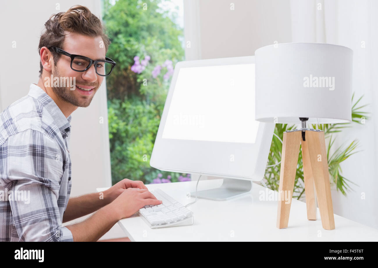 Happy handsome man working on computer Stock Photo - Alamy