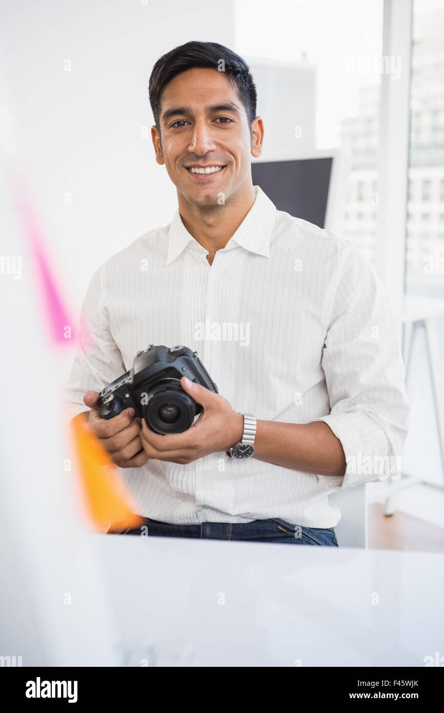 Young smiling businessman looking at the camera Stock Photo - Alamy