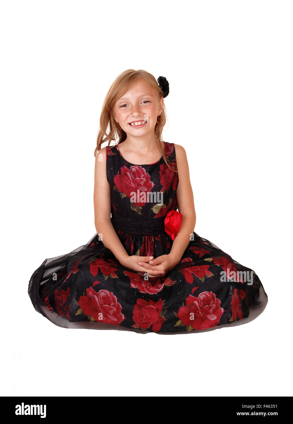 Smiling girl sitting on floor Stock Photo - Alamy