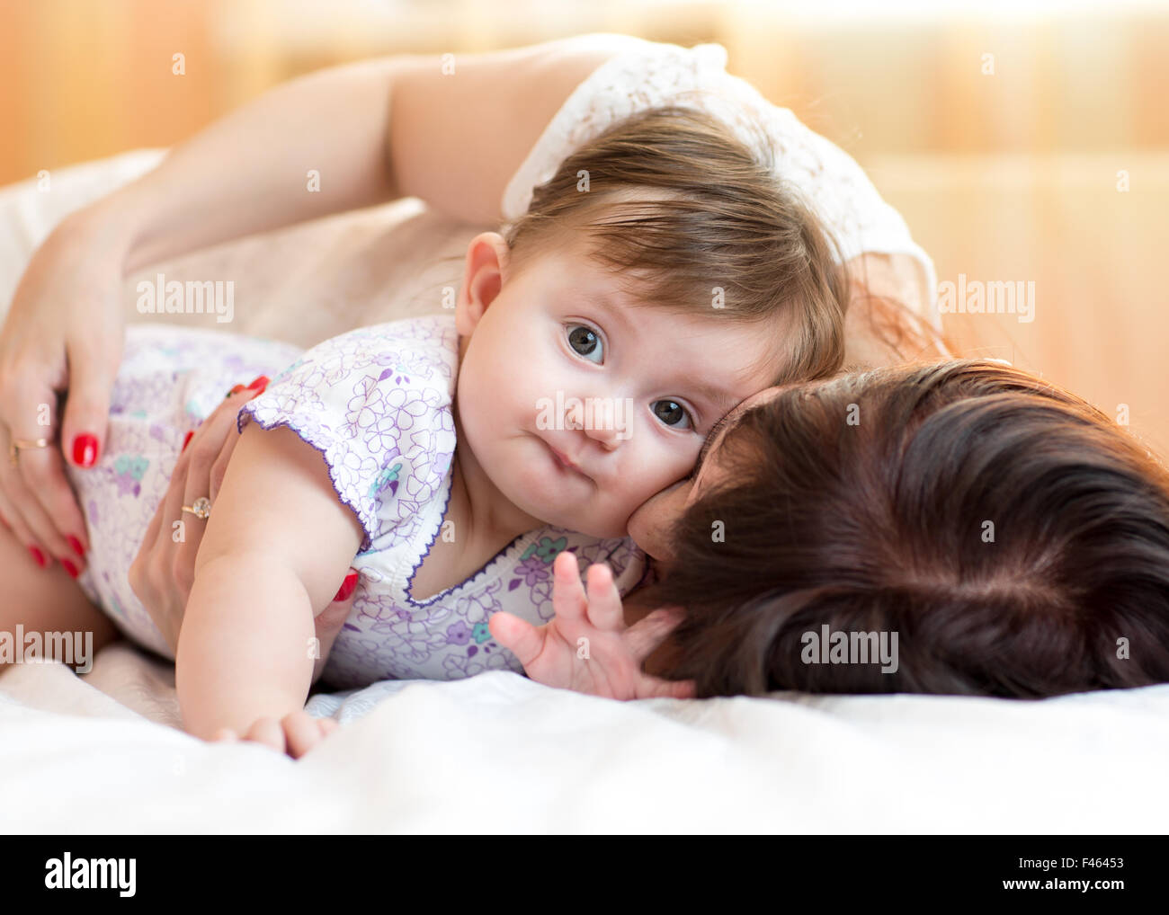 happy mother hugging her baby daughter Stock Photo