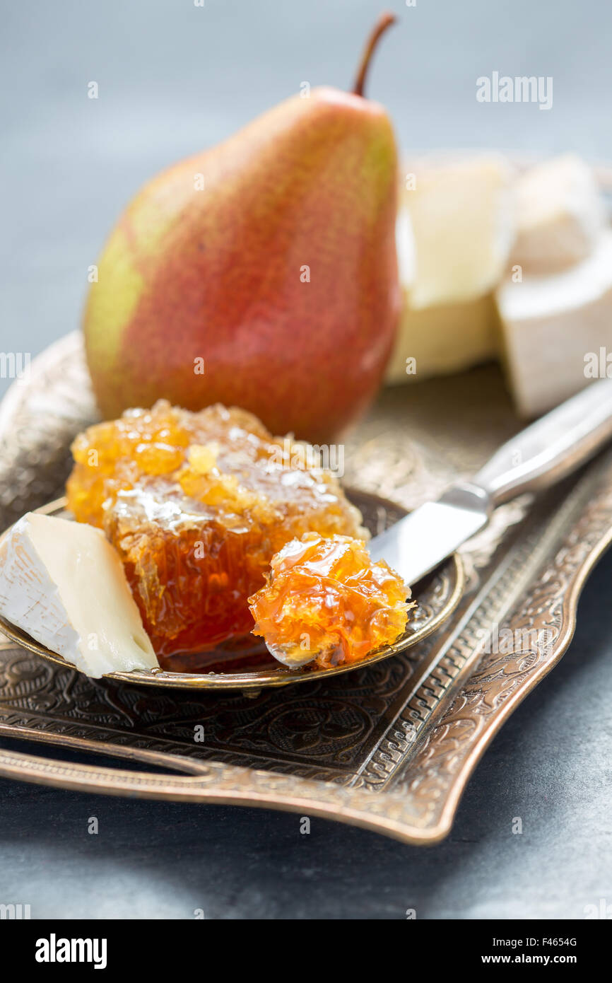 Delicious breakfast - brie, honey and pear. Stock Photo