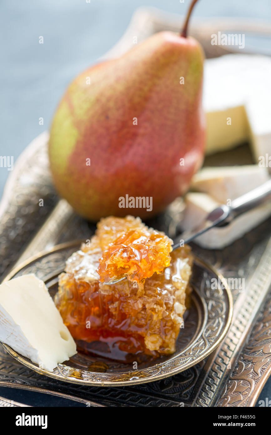 Brie cheese, honey and pear Stock Photo Alamy