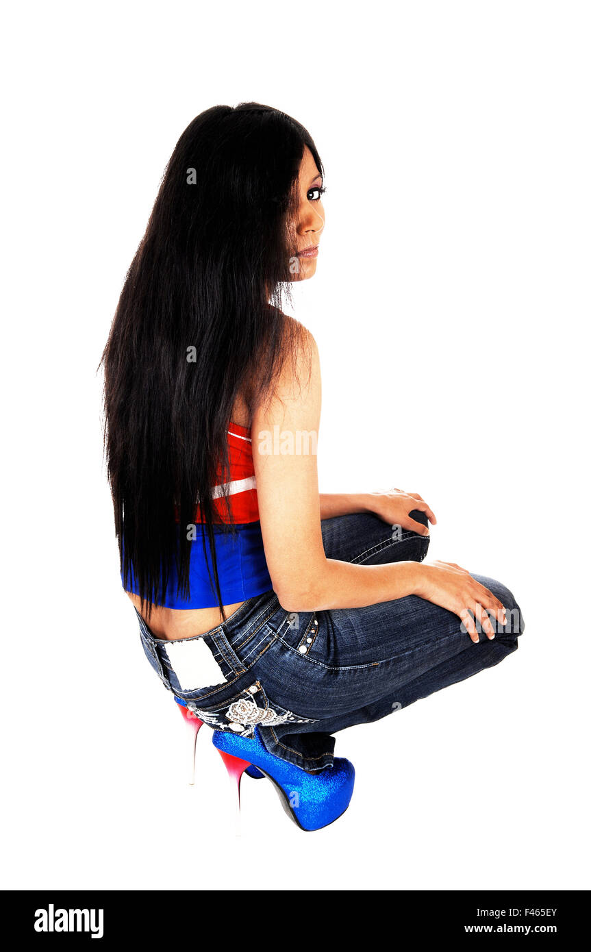 Young female model crouching on hi-res stock photography and images - Alamy