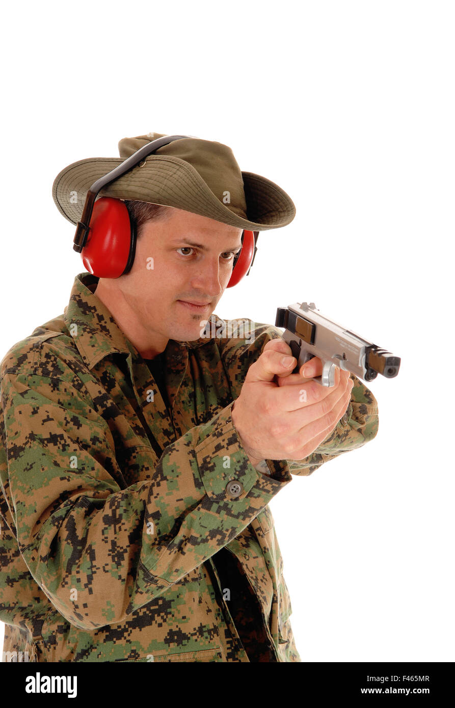 Soldier pointing a pistol. Stock Photo